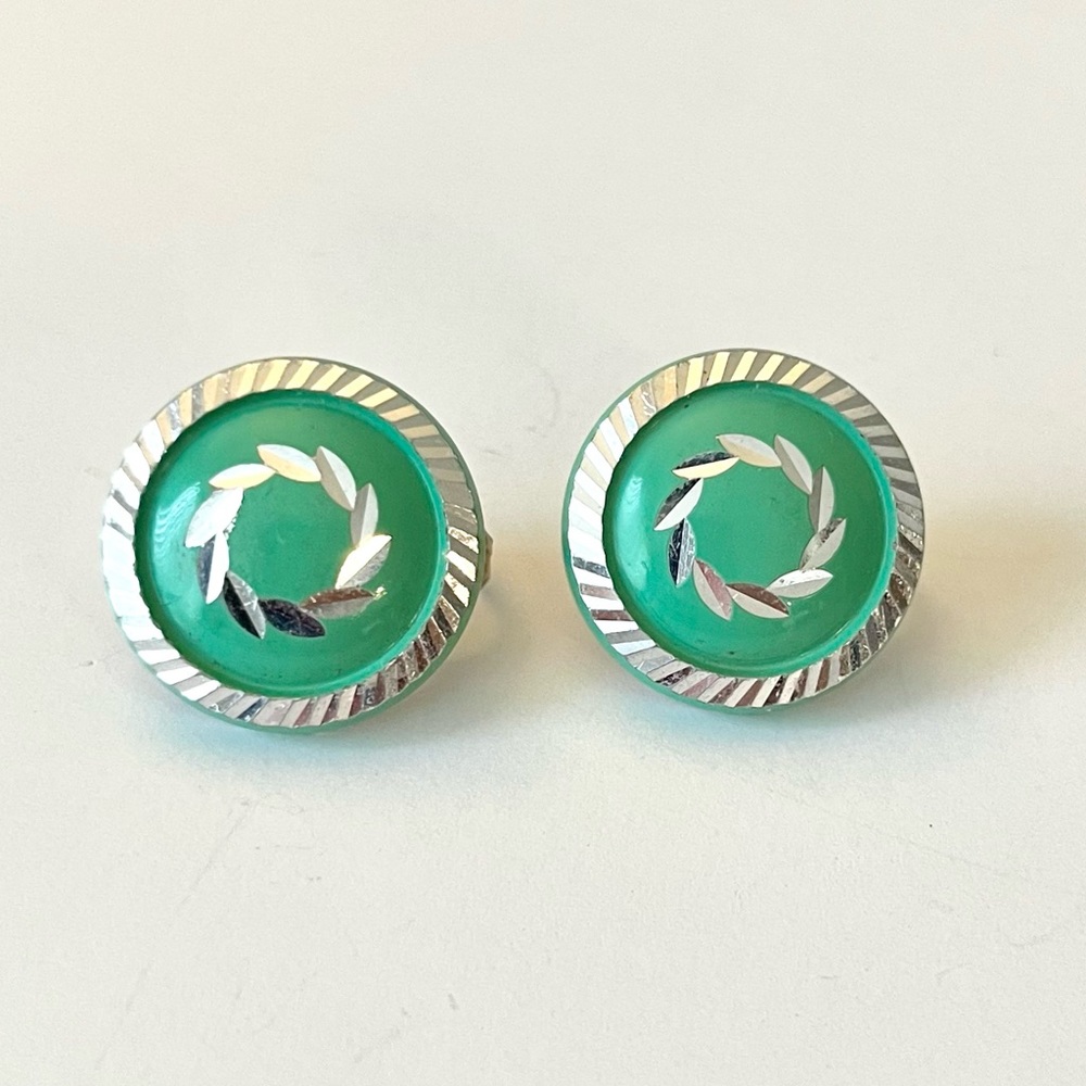 Minty green vintage clip on earrings. Marked WGERMANY. 3/4”. Great condition.